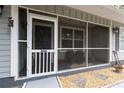 Inviting screened front porch with chairs and ample space for relaxation at 7340 20Th, Zephyrhills, FL 33540