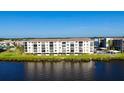 Scenic exterior of waterfront condo building with serene water views at 8211 Brent St # 836, Port Richey, FL 34668