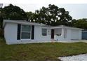 Lovely single-story home featuring fresh white paint and well-kept landscaping at 9116 Gray Fox Ln, Port Richey, FL 34668