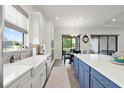 Bright kitchen with view to water boasts stainless appliances and island with seating at 11398 Juglans Dr, Odessa, FL 33556