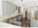 The kitchen features light gray cabinets and modern flooring at 11406 Labrador Duck Rd, Weeki Wachee, FL 34614
