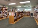 Well-stocked community library featuring rows of bookshelves with a wide selection of reading material at 11619 Boynton Ln, New Port Richey, FL 34654