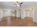 Spacious living room featuring laminate flooring and neutral walls at 12155 Environmental Dr # 8, New Port Richey, FL 34654