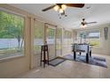 Sun-filled bonus room with large windows and a foosball table at 13923 Pathfinder Dr, Tampa, FL 33625