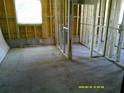 An interior view of a room with exposed wood framing and a window, showing an ongoing project at 2914 N 17Th St, Tampa, FL 33605