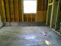 Interior view of a room with wood stud framing and a window, floor shows signs of wear at 2914 N 17Th St, Tampa, FL 33605