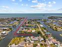 Aerial view showcases the property's prime waterfront location with direct access to the open water and scenic surroundings at 4387 6Th Isle Dr, Hernando Beach, FL 34607
