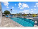Beautiful pool area featuring a slide, lounge chairs, and a waterfront view, perfect for relaxation at 4387 6Th Isle Dr, Hernando Beach, FL 34607