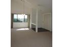 Bright living room featuring plush carpet, a large window with natural light, and high ceilings at 4529 Keelboat Pl, New Port Richey, FL 34652