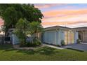 Beautiful exterior view of a charming home with well-maintained landscaping at 4942 Blue Heron Dr, New Port Richey, FL 34652