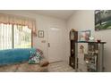 Welcoming entryway with decorative tile flooring, glass shelving, and natural light from a nearby window at 5309 Bayonne Ave, Spring Hill, FL 34608