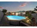 Backyard view of a refreshing pool with an enclosed patio area for outdoor enjoyment and relaxation at 5330 Dove Dr, New Port Richey, FL 34652