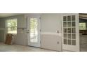 An unfinished kitchen with natural light coming through the window and the door at 6234 Cyril Dr, Dade City, FL 33523