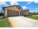 A well-maintained driveway leads to an attached two-car garage in a charming home at 10155 Duffy Cir, Weeki Wachee, FL 34613