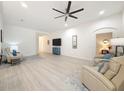 Spacious living area with hard wood floors and a ceiling fan at 13349 Niti Dr, Hudson, FL 34669