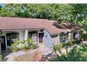 Single-story home with stone accents, manicured landscaping, and inviting curb appeal at 2139 Sea Pines Ct, Spring Hill, FL 34606