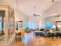 Spacious living room boasts vaulted ceilings, hardwood floors, and ample natural light at 3627 Muirfield Ct # 3627, New Port Richey, FL 34655