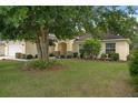 Charming home featuring lush landscaping around the front yard at 3631 Celebration Dr, Brooksville, FL 34604
