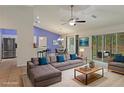 Staged living room with modern furnishings, bright colors, and an open floor plan at 3631 Celebration Dr, Brooksville, FL 34604
