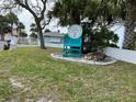 Charming entrance to a private beach club, nestled in lush landscaping and tranquil beachside ambience at 4854 Marine Pkwy # 103, New Port Richey, FL 34652