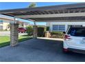 A covered parking area for the condominium complex, offering shade and protection at 4854 Marine Pkwy # 103, New Port Richey, FL 34652