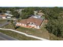 Spacious property on a corner lot with a well-maintained yard, mature trees, and a screened-in pool at 5423 Abagail Dr, Spring Hill, FL 34608