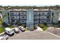 Three-story condominium with multiple balconies, mature landscaping, and convenient parking at 5627 Ferguson Ct # 1303, New Port Richey, FL 34652