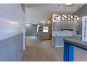 Modern kitchen with updated countertops, pendant lighting, and an open layout to other living spaces at 6172 Raleigh St, Spring Hill, FL 34606