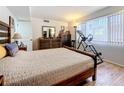 Bedroom with wood flooring, large windows, and comfortable furnishings at 700 Starkey Rd # 622, Largo, FL 33771
