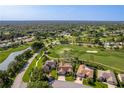 Aerial view of the property highlighting its location on the golf course, in a private community at 8132 Summersong Ct, Spring Hill, FL 34606
