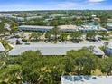 A pleasant aerial view shows lush surroundings, adjacent to community pool and recreation center at 8405 112Th St # 103, Seminole, FL 33772