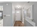 Neat home entryway featuring wood floors and neutral gray paint at 9622 Brassie Ct # 9, New Port Richey, FL 34655