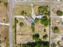An aerial view showing the property with a private pool, outbuilding and plenty of land at 14031 Hexam Rd, Brooksville, FL 34613