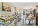 Elegant living room with hardwood floors, neutral colors, and ample natural light at 18223 Nestlebranch Ct, Hudson, FL 34667