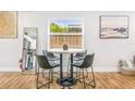 Stylish dining area featuring modern chairs, a round table, and wood-look floors at 4057 67Th N Ave, Pinellas Park, FL 33781