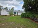 Charming single-story home with well-maintained landscaping and a white exterior at 6197 Belkton Ave, Spring Hill, FL 34608