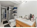 Bathroom featuring marble sink top, walk-in shower, and black floor mat at 8634 Roble Way, Port Richey, FL 34668