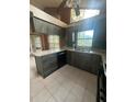 Bright kitchen features unique cabinetry, stainless sink, and ample counter space at 8755 Marigold Dr, New Port Richey, FL 34654