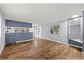 Spacious living room featuring laminate floors and an open layout at 9401 Bourbon St, New Port Richey, FL 34654