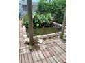 Outdoor pond with brick border and lush greenery adding a tranquil element to the backyard at 9516 Glen Moor Ln, Port Richey, FL 34668
