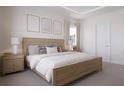 Serene bedroom featuring a comfortable king-size bed, soft lighting, and neutral décor at 9533 Vibrant Ln, Venice, FL 34292