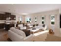 Bright, open-concept living space featuring modern furnishings and large windows for natural light at 9533 Vibrant Ln, Venice, FL 34292