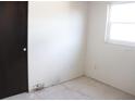 A simple bedroom with a closet and a window, offering a clean and bright space at 101 Sheryl Lynn Dr, Brandon, FL 33510