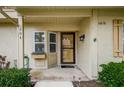 Inviting entrance with flower box and a well-kept walkway leading to the front door at 10670 43Rd N St # 204, Clearwater, FL 33762
