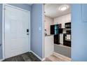 Modern kitchen with white cabinets, stainless steel appliances, and sleek countertops at 10670 43Rd N St # 204, Clearwater, FL 33762