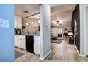 Open-concept living space flowing from the kitchen and featuring hardwood floors at 10670 43Rd N St # 204, Clearwater, FL 33762