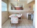 The dining area is filled with natural light and offers a cozy space for Gathering meals or gatherings at 11733 Bayonet Ln, New Port Richey, FL 34654