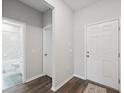 Welcoming entryway features a tiled bathroom and neutral decor at 12313 Criollo Rd, Spring Hill, FL 34610