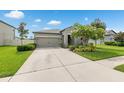 Beautiful single-story home features well-manicured landscaping and a large driveway for easy access at 12313 Criollo Rd, Spring Hill, FL 34610