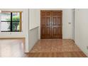 Inviting foyer with tile flooring and natural light, leading to the living areas at 128 Oak Lake Dr, Spring Hill, FL 34608
